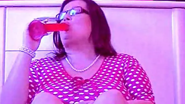 Fatty in polka dot top using toy