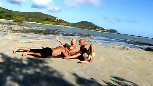 Erotic threesome with hot girl on beach