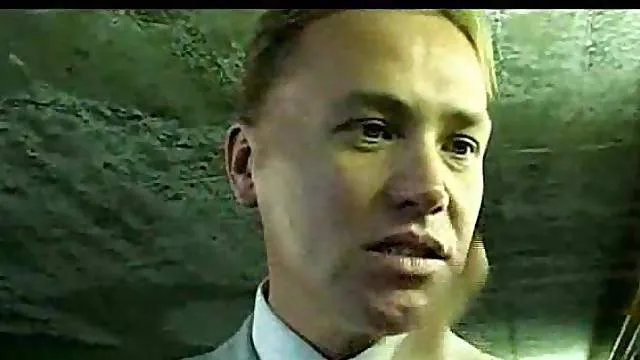 Chick in a parking lot bent over her car