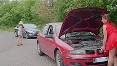 Two blondes have a broken car