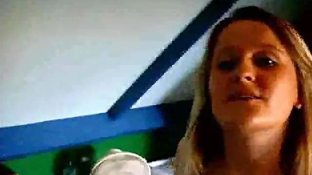 Girl in boots and stockings using a toy