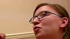 Mistress with glasses swallows