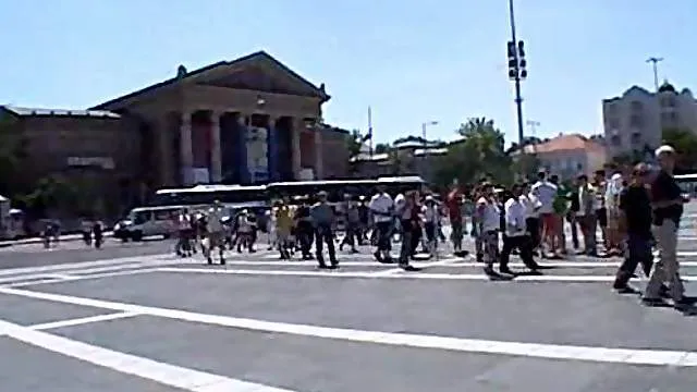 Chick sucking cock in a public square