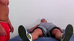 Rough torture session with one man tied up and two dudes tickling him