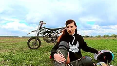 Naked woman riding a Dirt Bike