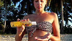 Hot Maria loves to get naked on the beach and drills her slit