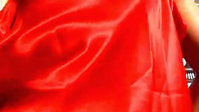 Stripping from satin to play with her tits