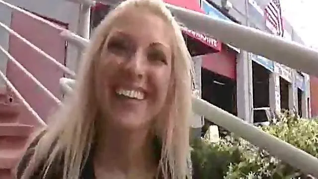 Girl in a public park has fun flashing us