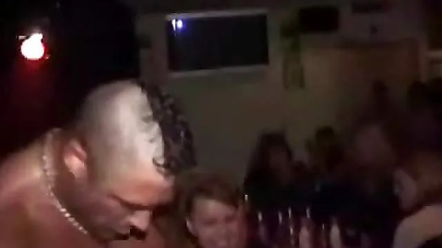 Chick at the club eating and stroking dick