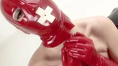 Madame Adore dressed in full leather red outfit rides a fuck machine