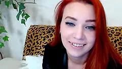 This sexy redhead with big natural boobs play on her webcam.