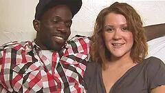 Interracial fucking on the sofa with a BBC and a smiling blonde