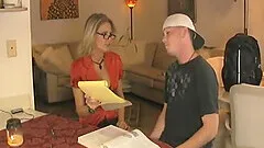 Blonde mature with glasses teases him with her rack and jerks him off