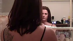 Desirable hottie teases with her tattoo and her big tits in various positions.