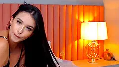 This brunette babe is dynamite from her long lustrous locks to her fit slender figure