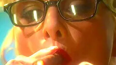 Blonde mature lady with glasses smokes a cigar and plays with her tits