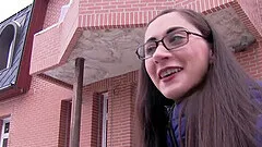 Brunette teen with glasses fucks for money in front of the camera