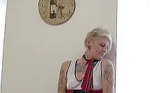 Hottie with tattoos shows off her good bits while wearing an astonishing outfit.g