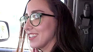 Brunette chick Charlie Stevens shows off her sexy body in a car