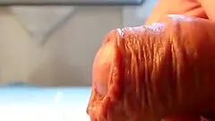 a close-up video of me playing with my foreskin.