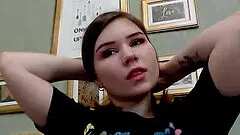 Hot babe is wearing a flirty bustier top that shows her fit stomach and awesome cleavage