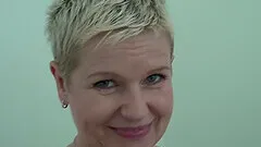 Once she was done stripping, she shoved a big blue dildo inside of her pussy.