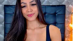 Brunette babe shows off her cleavage with busty boobs cuddled inside of her bra