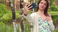 Nelya puts a finger on her clit during the masturbation in the nature