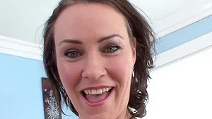 Kinky babe Nora Skyy strips and teases with her hairy vagina