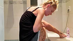 cute Claudia M masturbates using her fingers and a toy in the bath
