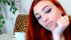 Redhead babe will steal your breath away as she greets in front of her webcam