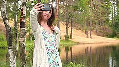 Skinny brunette teen slut Nelya strokes her pussy outdoors