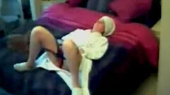 After a shower my wife grabs her big vibrator and masturbates with her legs wide on her bed.