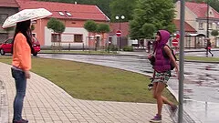Rain doesn't stop a cute lesbian couple to finger each other outdoors