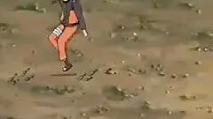 Male ninja and a female ninja fight each other in a volcano crater.