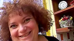 Buxom BBW solo mature model stuffs her pussy with a huge toy