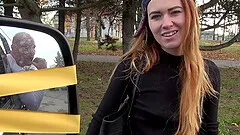 Tattooed long haired brunette teen deepthroats at a public park