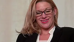 Nerdy mature blonde Scarlet takes off her uniform and masturbates