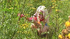 Teen lesbian babes in shorts have fun with toys outdoors