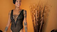 Gorgeous tattooed ebony teen Honey Gold strips and fingers her pussy