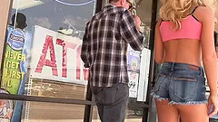 Blonde babe in shorts Katerina Kay sucks a glory hole cock in public