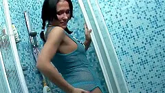 Nila uses a blue sex toy to make her tight pussy dripping wet