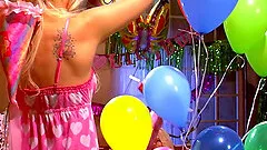 Jana Jordan and Jayme Langford play with toys for birthday