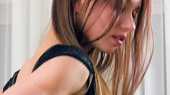 Brunette girl Taylor Sands moans while she masturbates with a toy