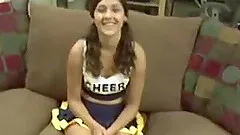 Brunette cheerleader gets her wet cunt pounded on the couch