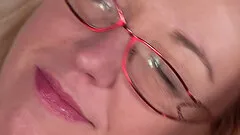 Horny woman Jane M wears glasses while making her pussy warm