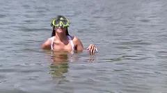 Small-titted brunette spreading and fingering her cunt in the nature