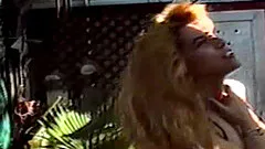 A bigboobed blonde is bored and horny at the park outside her condo.