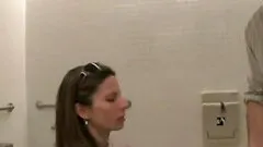 sexy brunette bitch enjoys to suck a lucky dude in the public toilets
