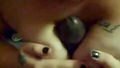 White girl titty fucks a big black cock